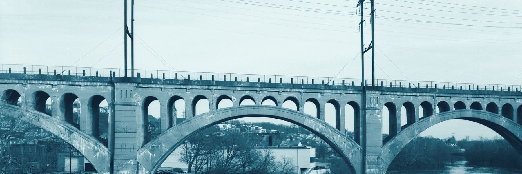 The Manayunk Bridge’s concrete arches over the Schuylkill River, in Trestl’s colours.